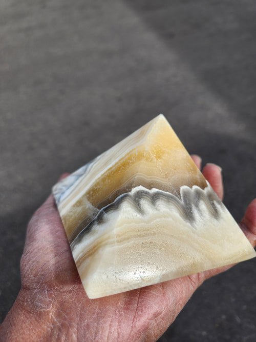 Zebra Onyx Pyramid: A Powerful Symbol of Balance, Protection, and Energy Amplification