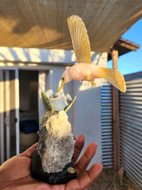 Rose Quartz and Yellow Calcite Bird carving on Agate Rose Perched on Crystal Geode with Onyx Base – A Symbol of Love, Clarity and Grounded Energy