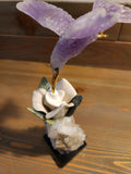 Amethyst Bird Carving on White Jade Rose with Green Jade Leaves, Perched on Calcite Geode with Onyx Base – A Harmonious Blend of Peace, Growth, and Spiritual Energy for Home, Office and Meditation Spaces